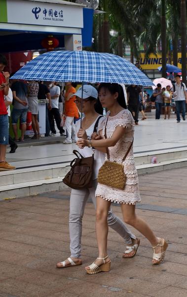 2 girls,1 umbrella